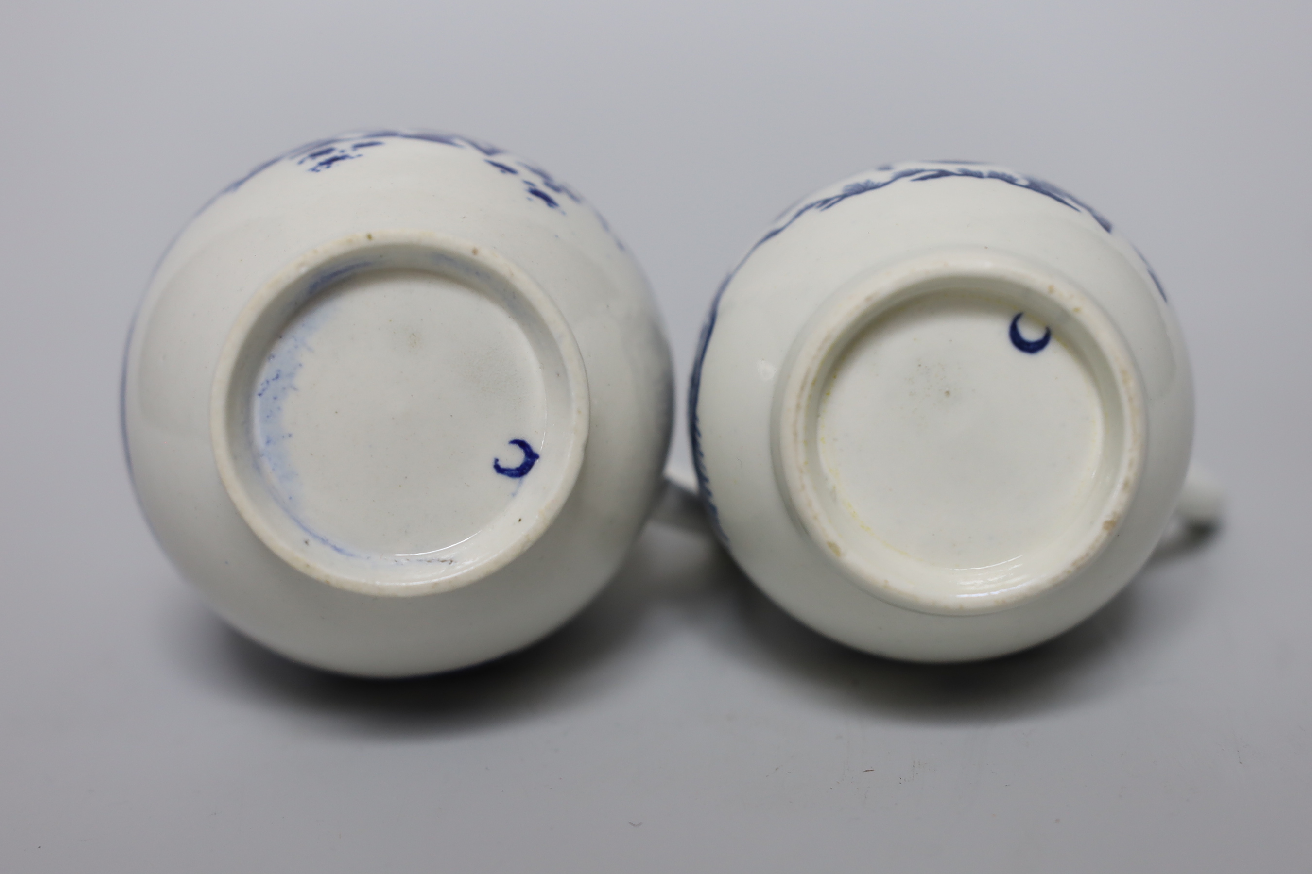 A Worcester sparrowbeak jug printed with the Fence pattern, another sparrowbeak similar and four Worcester coffee cups all printed with the Fence pattern